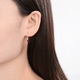 Model showcasing Dainty Round Hoop Earrings Red Ruby Hoop Earrings Rhodium Plated Silver Earrings Gift for Her