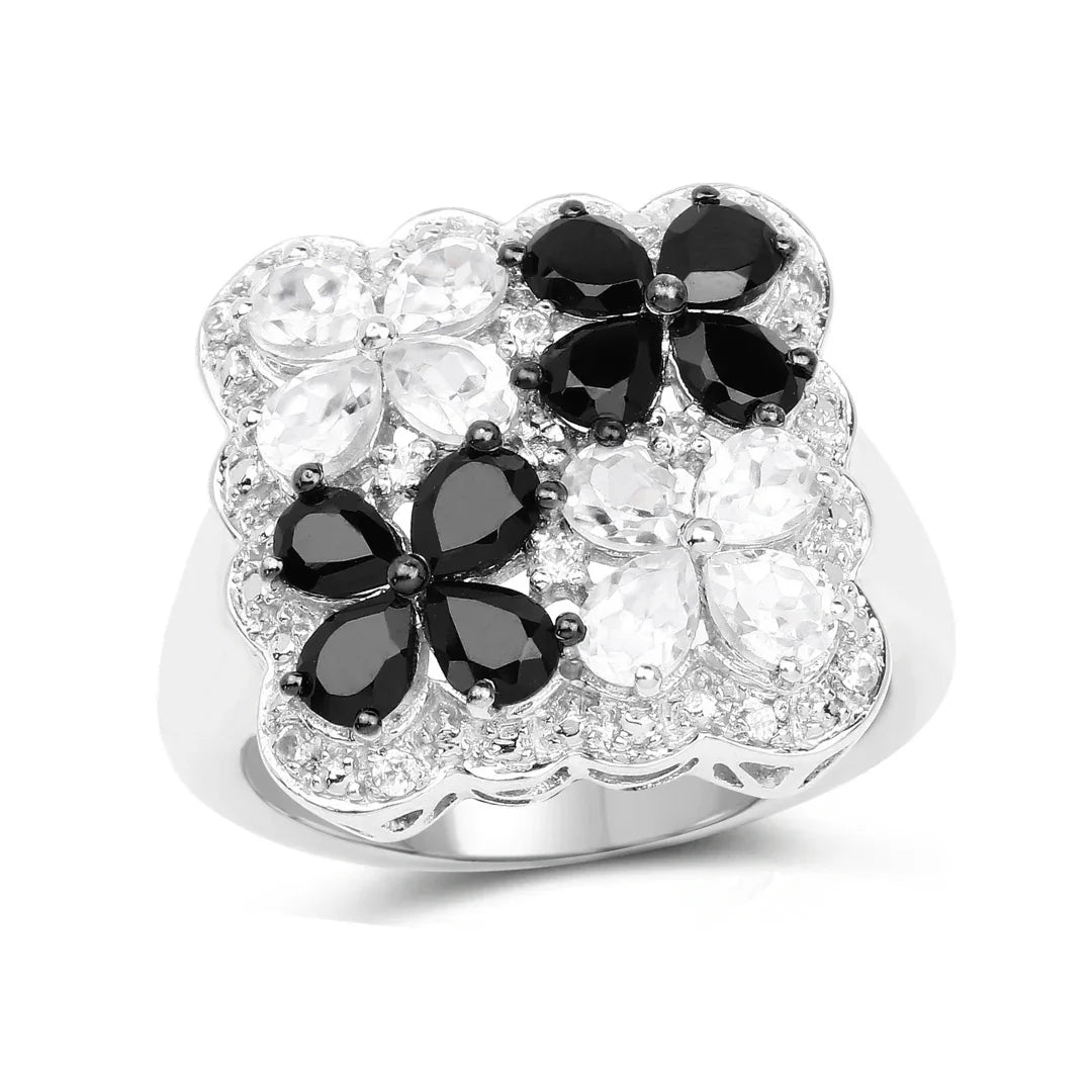 Anillo floral con espinela negra y topacio blanco