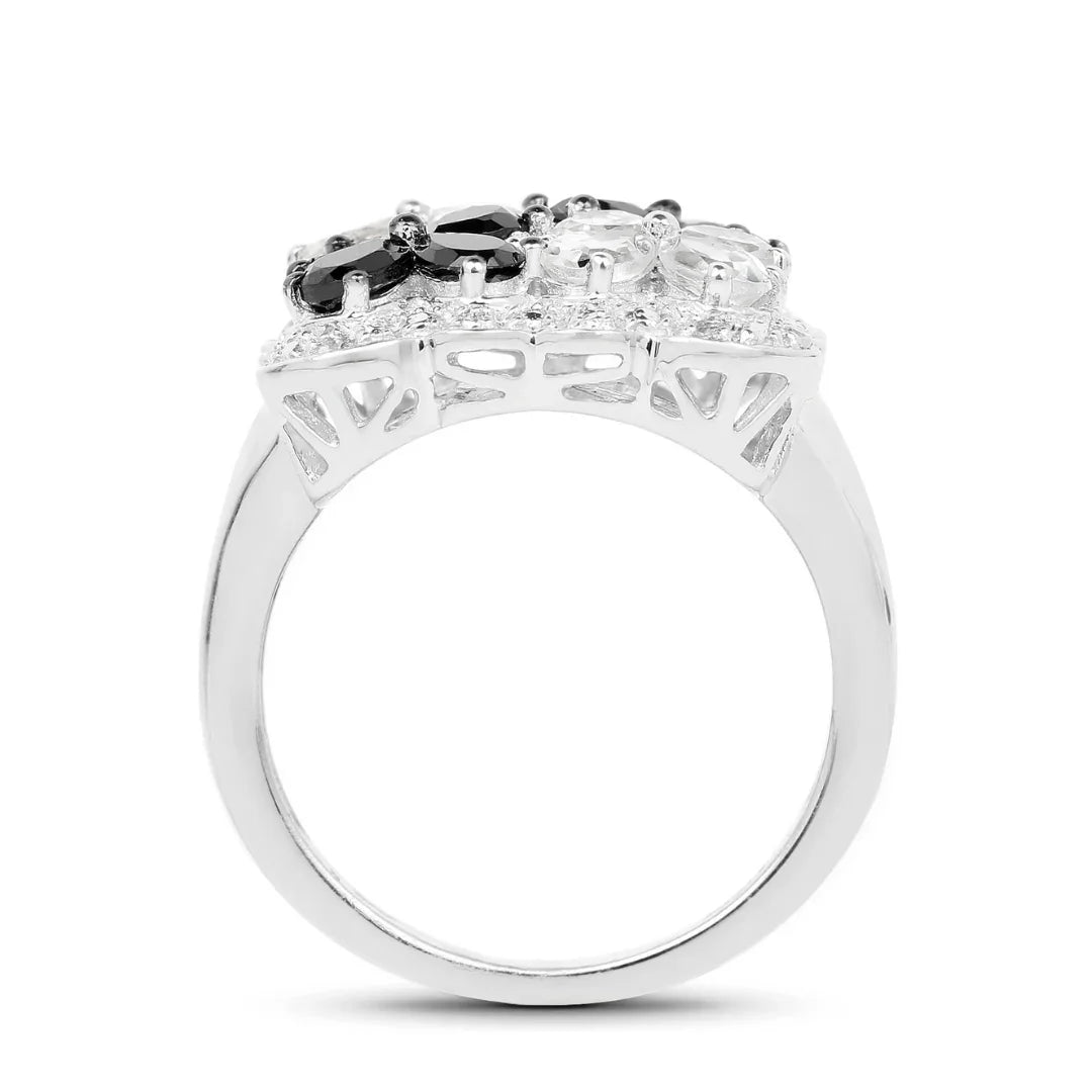 Anillo floral con espinela negra y topacio blanco