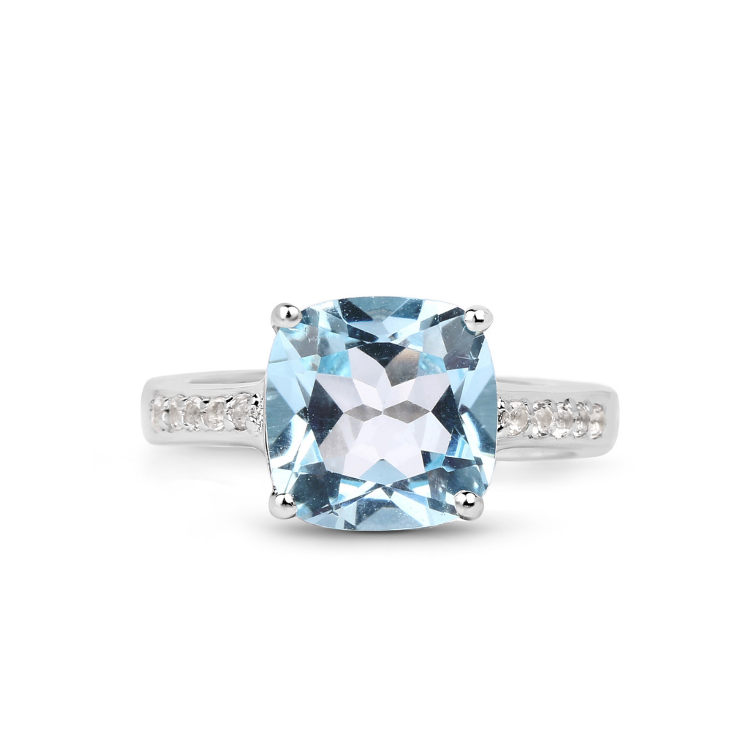 Anillo solitario de topacio azul en plata de ley con detalles de topacio blanco