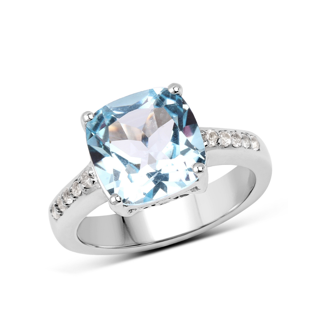 Anillo solitario de topacio azul en plata de ley con detalles de topacio blanco