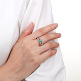 Model wearing emerald ring, round emerald ring design, solitaire ring design, emerald solitaire ring