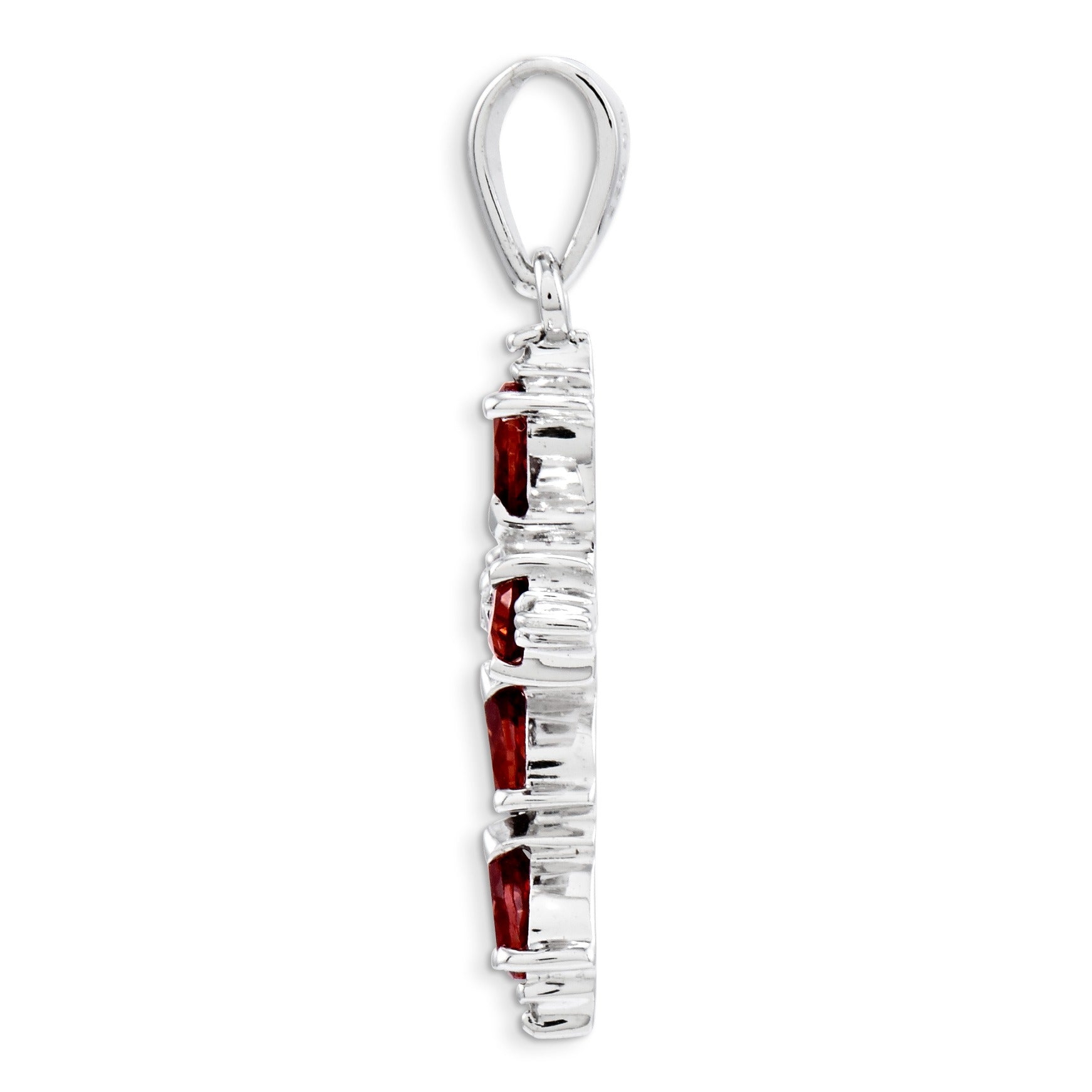 Side view of silver pendant with three red gemstones, elegant handcrafted jewelry detail