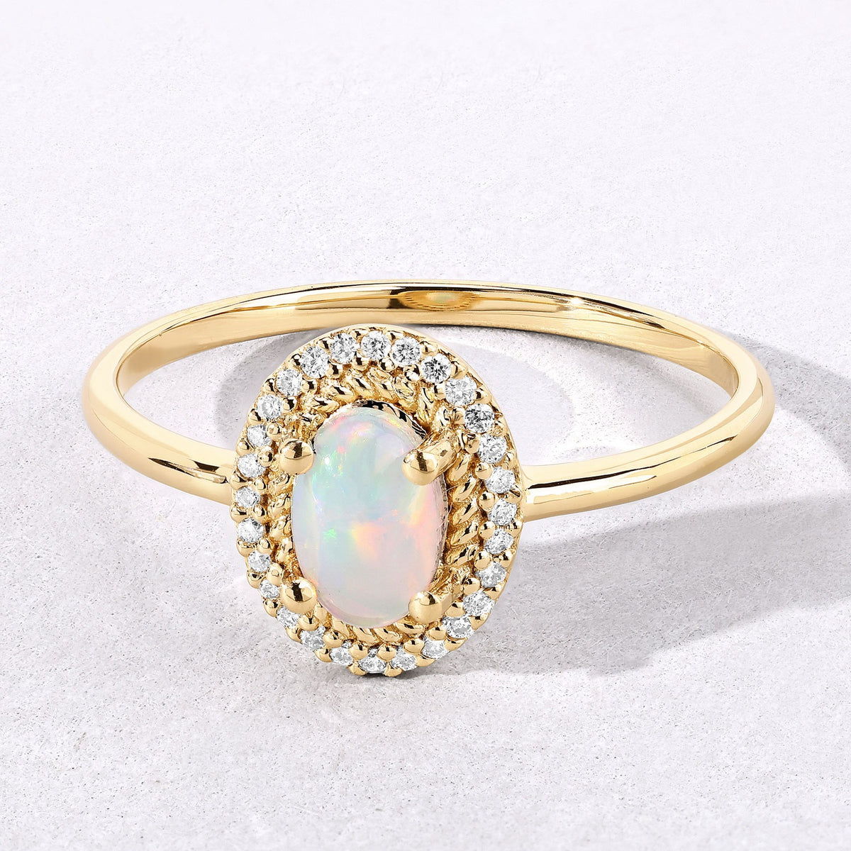 0.35 Cttw Oval White Ethiopian Opal Diamond 14K Yellow Gold Halo Ring