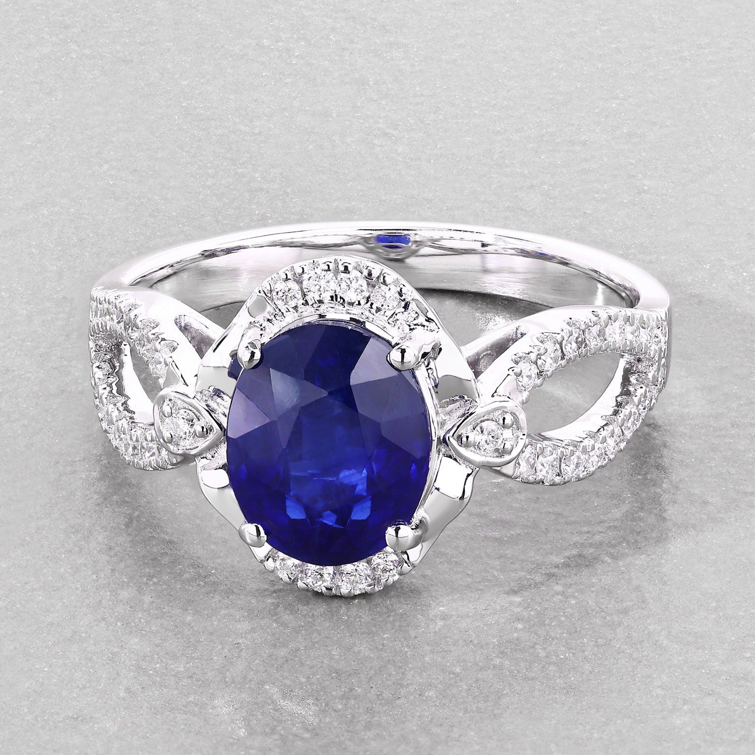 2.33 Ct Oval Ceylon Blue Sapphire and White Diamond Prong 18K White Gold Pave Halo Crossover Ring