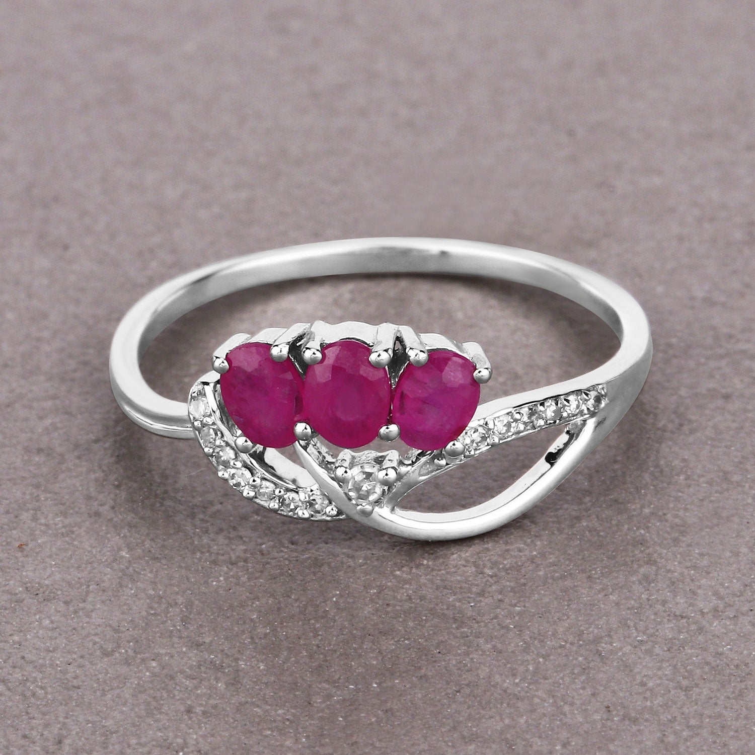 0.72 Ct Oval Shaped Pink Ruby and White Diamond Prong 14K White Gold Pave Three Stone Knot Ring