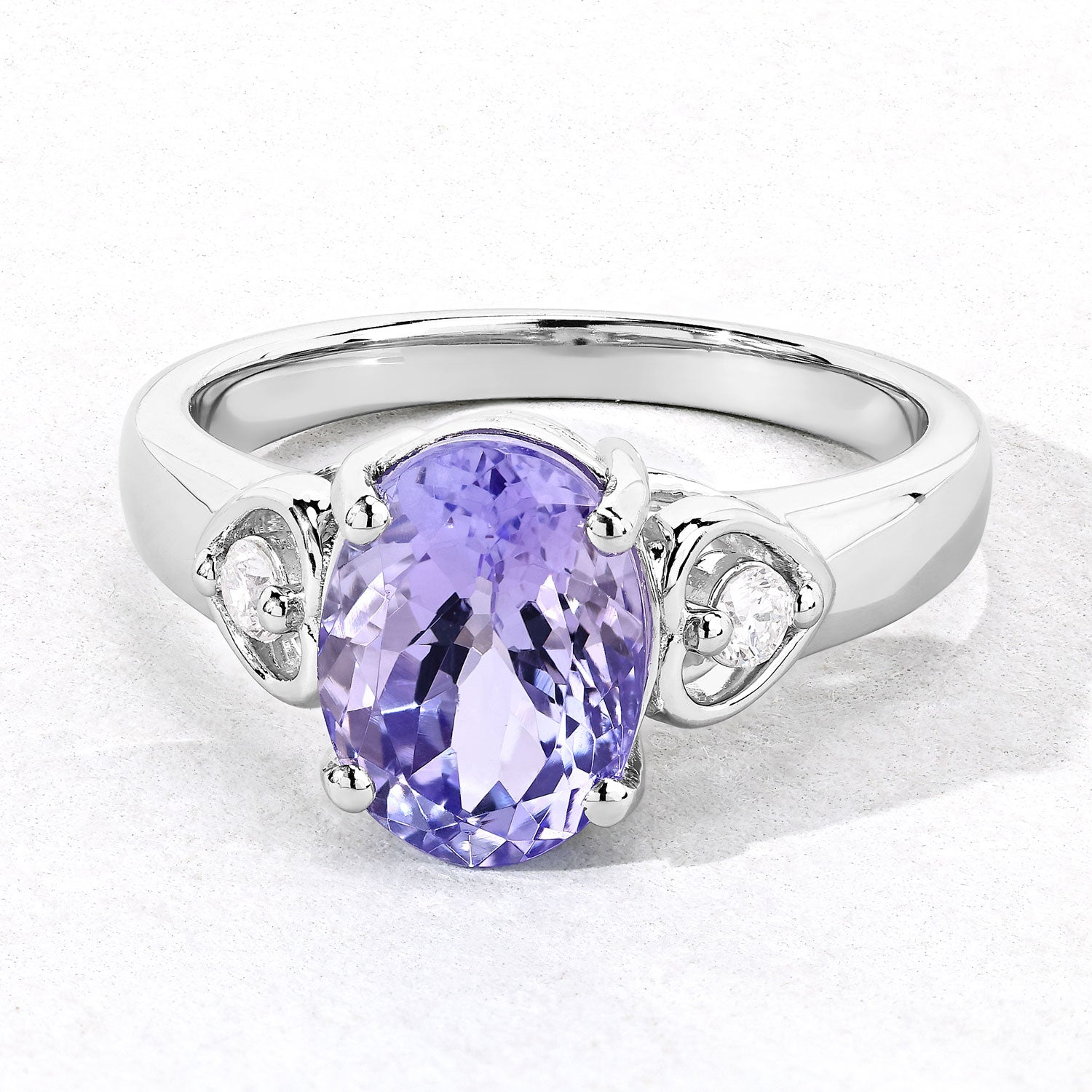 3.23 Cttw Oval Violet Tanzanite and Lab Diamond Rhodium over Silver 3-Stone Ring