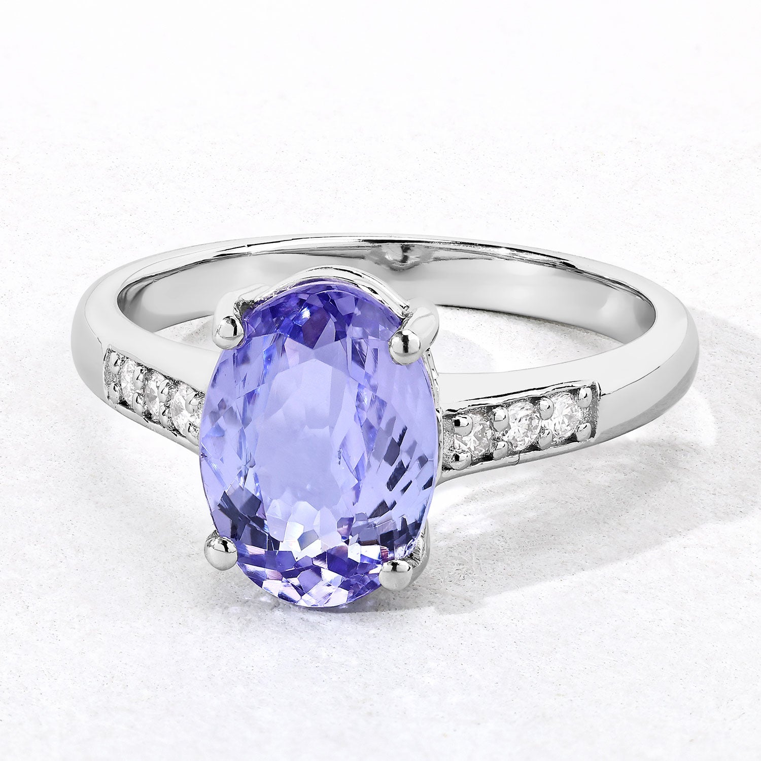 2.58 Cttw Oval Violet Tanzanite Lab Grown Diamond Rhodium over Silver Bridge Ring