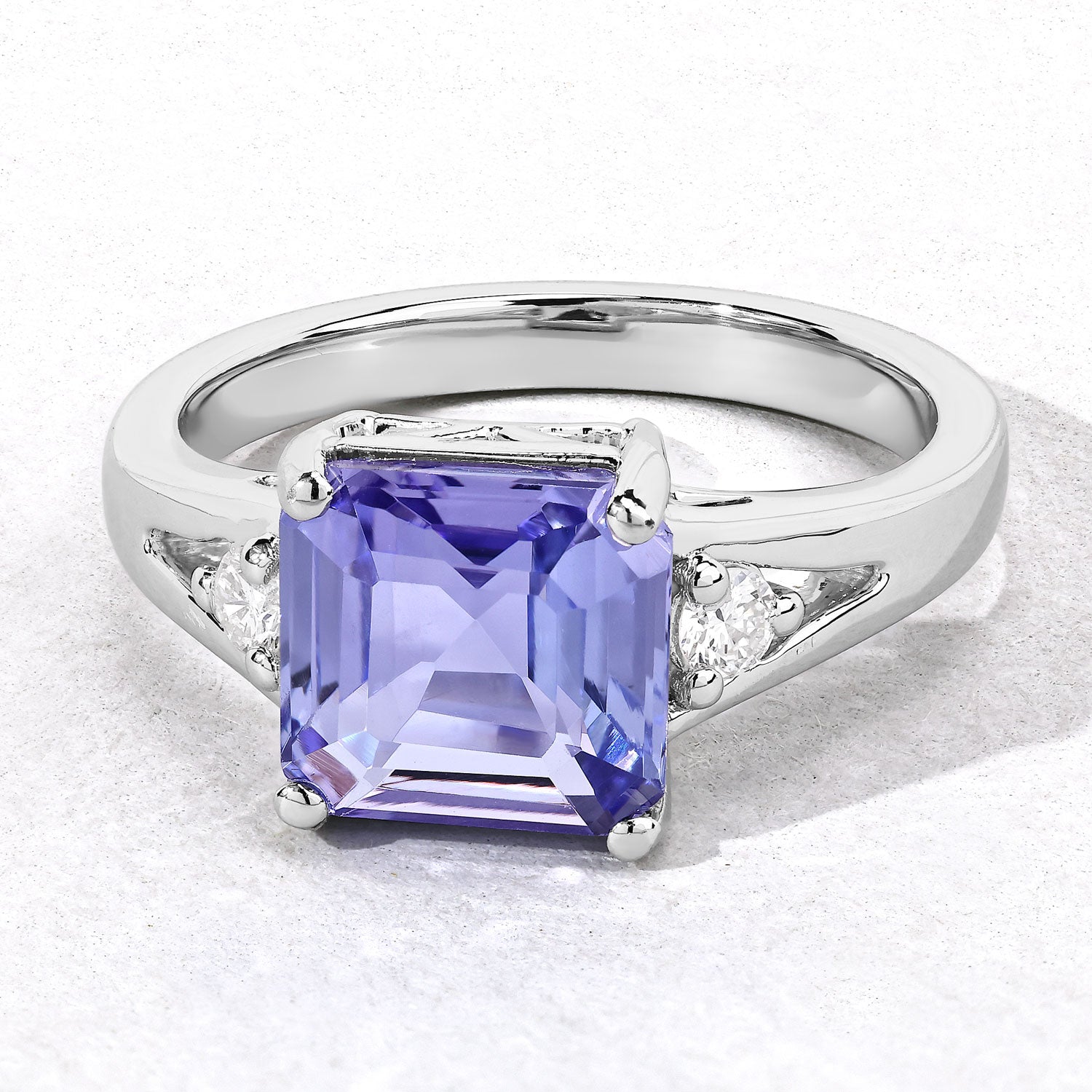 3.28 Cttw Octagon Violet Tanzanite and Lab Diamond Rhodium over Silver 3-Stone Ring