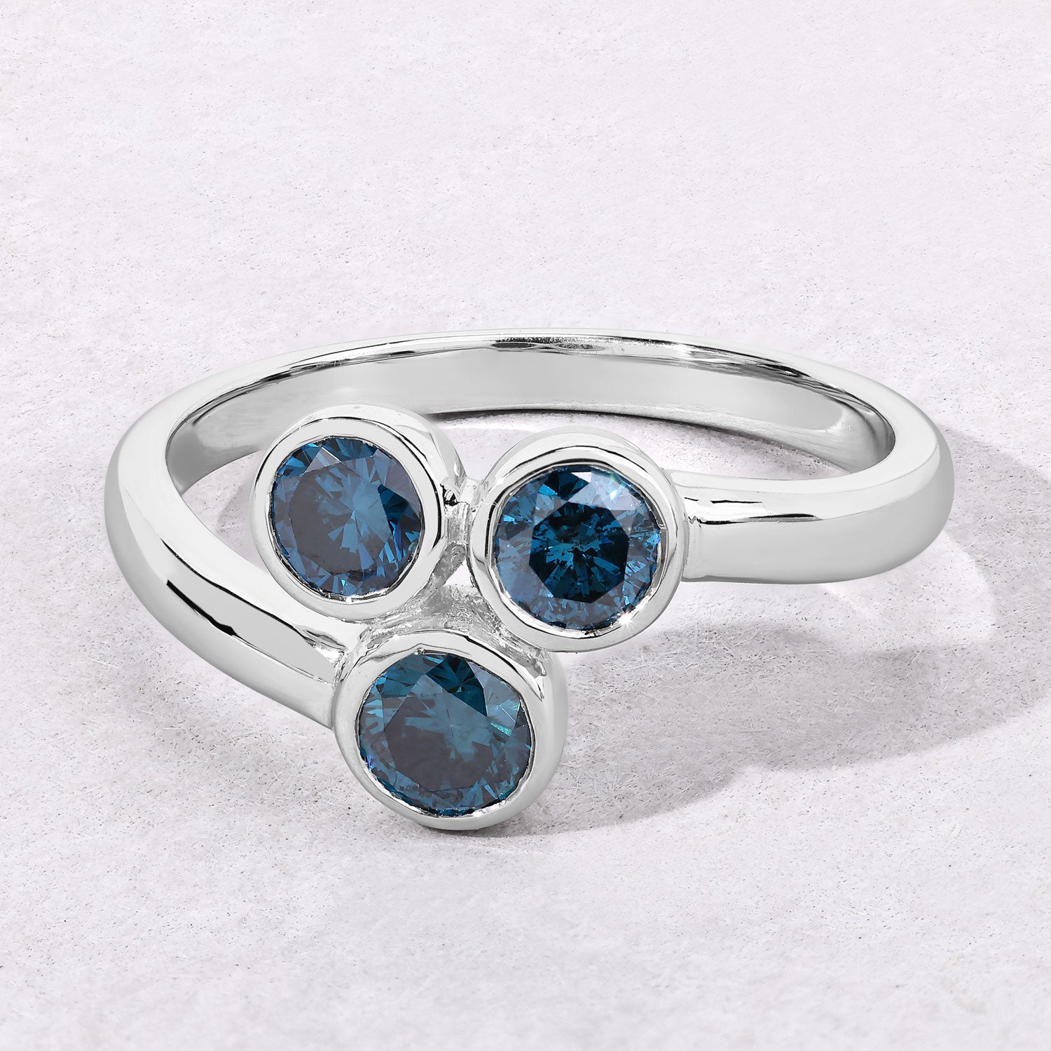 0.75 Cttw Round Teal Blue Diamond Bezel Rhodium Plated Silver Three Stone Bypass Ring