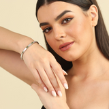 Elegant model hand showcasing the intricate details of our mother of pearl pearl bracelet chrome diopside june birthstone white pearl bracelet bridesmaid gift Office Wear bracelet pearl jewelry office jewelry work wear jewelry work wear bracelet motherpearl bracelet gift for her