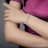 Elegant model hand showcasing the intricate details of our Natural White Zircon Bracelet Sterling Silver Dainty Bracelet 