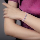 adjustable bracelet on model, woman wearing bracelet, sapphire bracelet on woman, model wearing sapphire jewelry