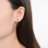 Model showcasing Genuine Ruby Halo Earrings with Moissanite Accents Gold Plated Silver Stud Earrings