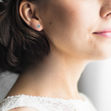 Model showcasing Minimalist Solitaire Studs Sterling Silver September Birthstone Earring