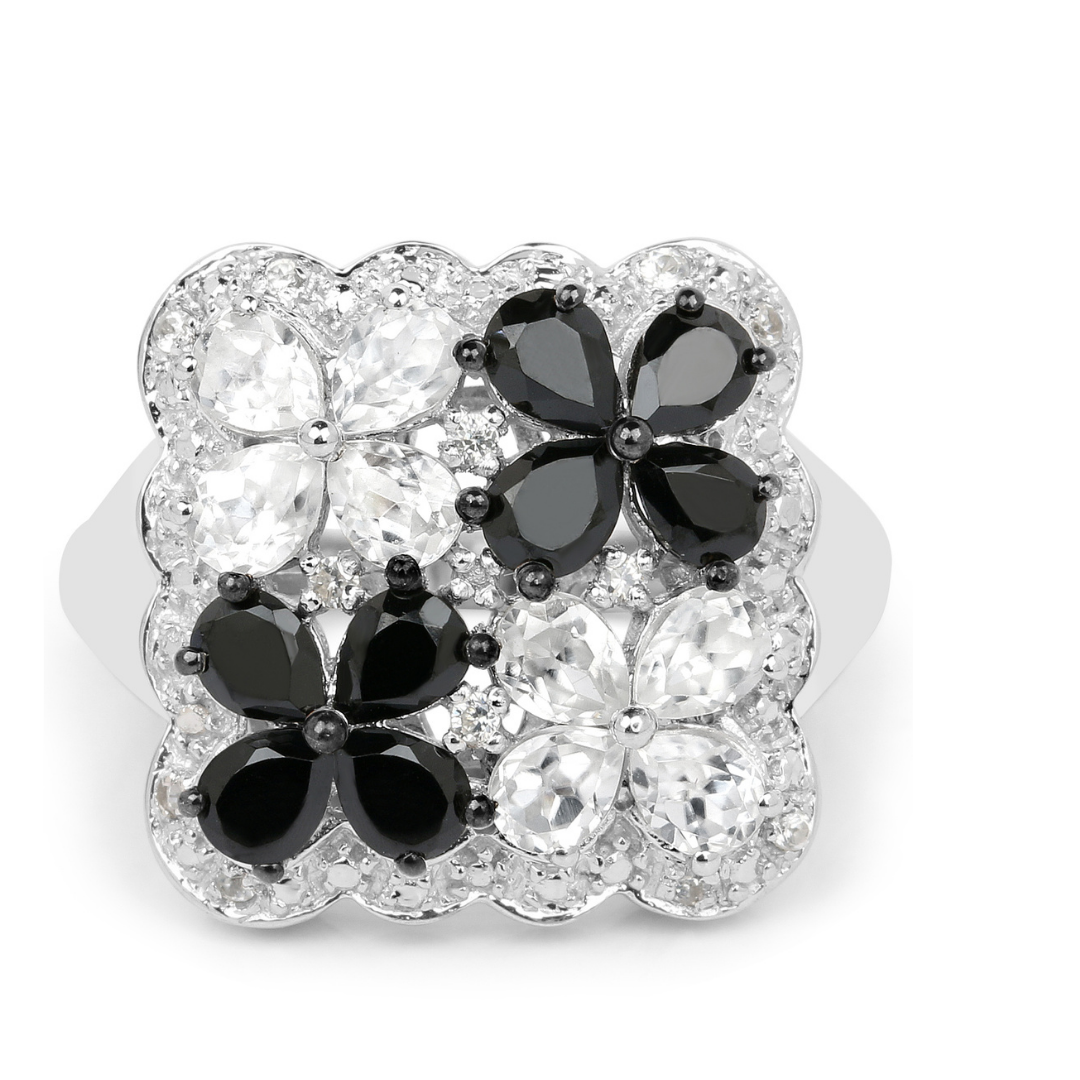 Anillo floral con espinela negra y topacio blanco