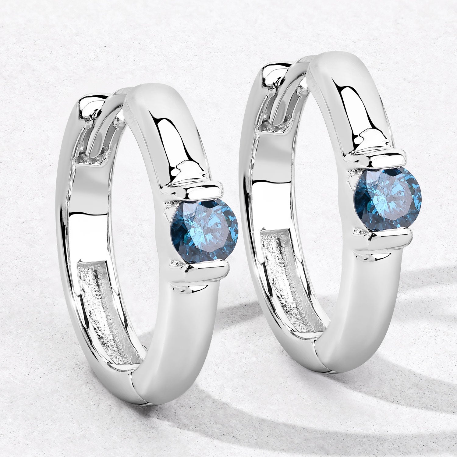 0.35 Cttw Round Teal Blue Diamond Channel Rhodium Plated Silver Huggie Hoop Earrings