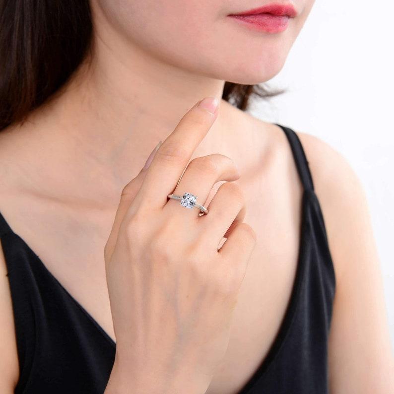 women in topaz solitaire ring, women in solitaire ring, white topaz rings for women