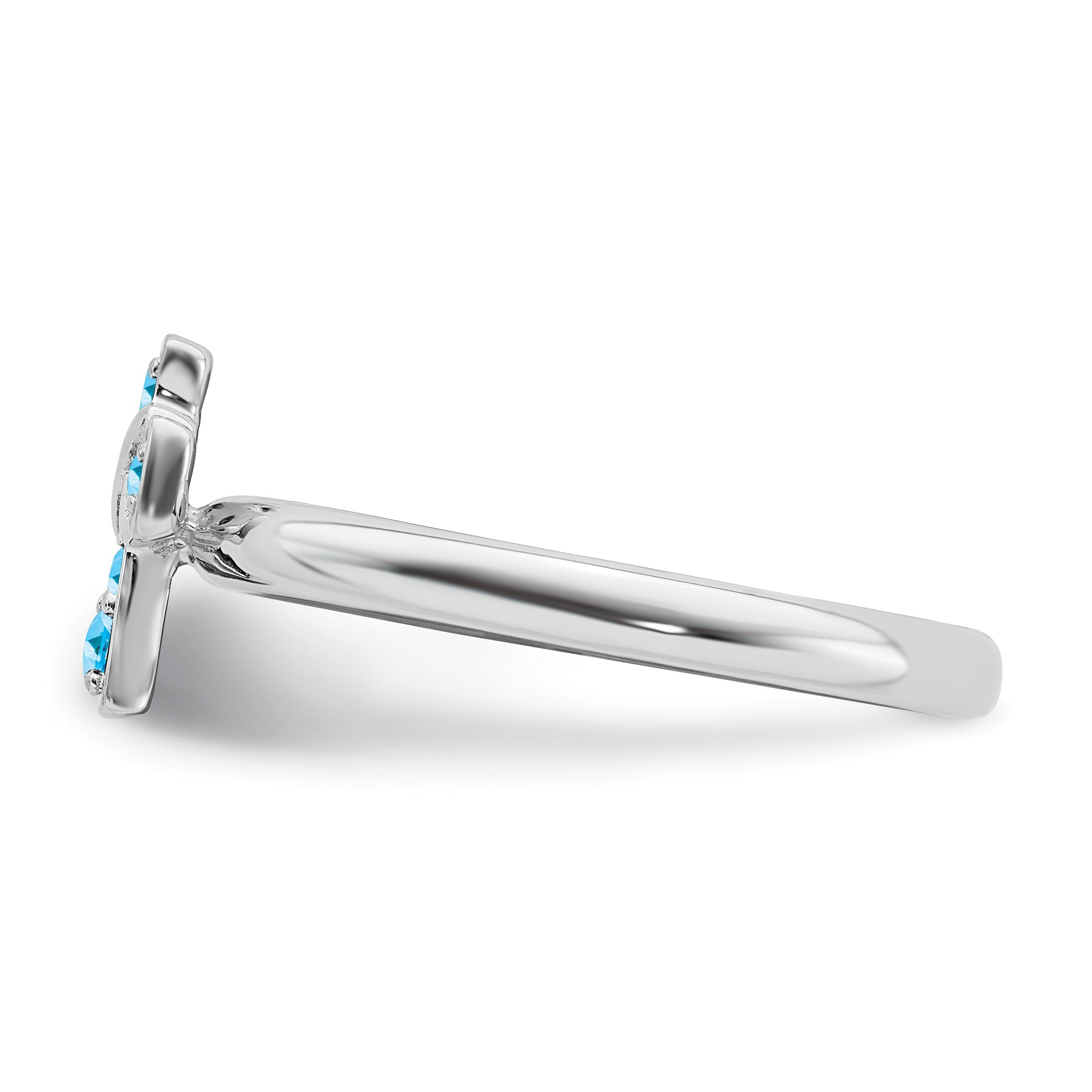 Silver ring with a flower-shaped setting featuring blue gemstones on a white background