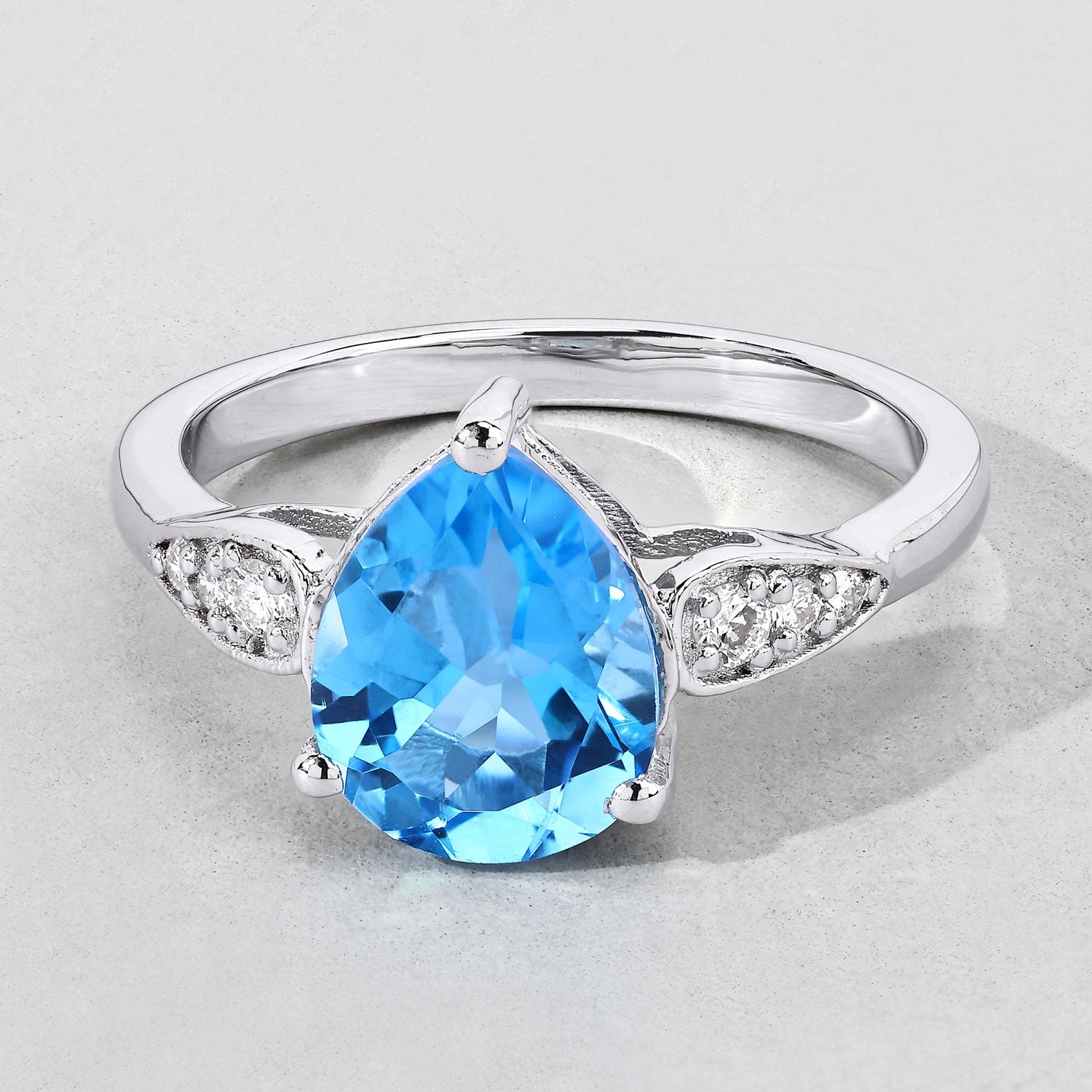 2.71 Ct Genuine Swiss Pear Shaped Blue Topaz and Lab Diamond Silver Bypass Ring