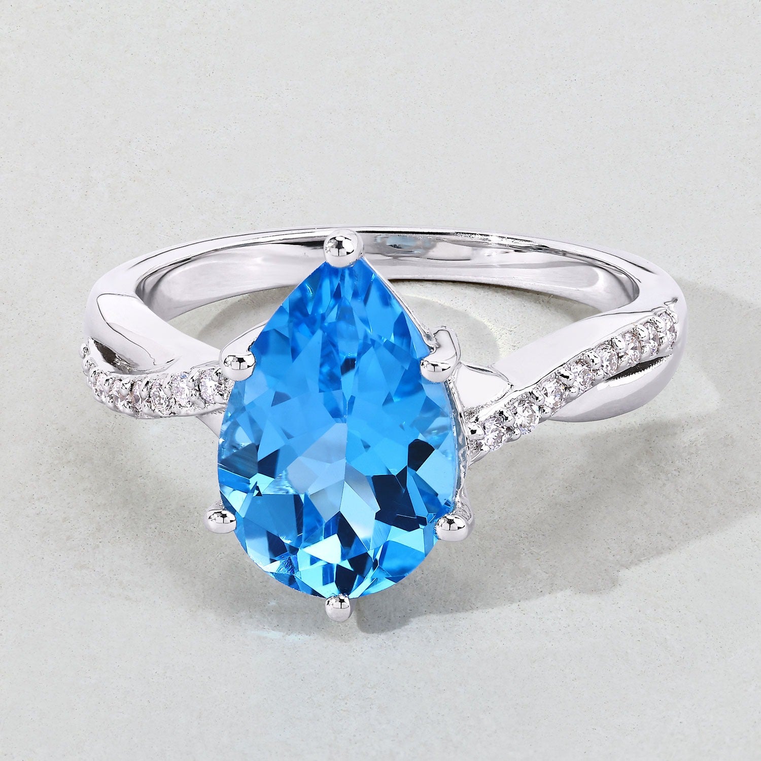 3.62 Ct Genuine Pear Shaped Swiss Blue Topaz and Lab Diamond Silver Bypass Ring