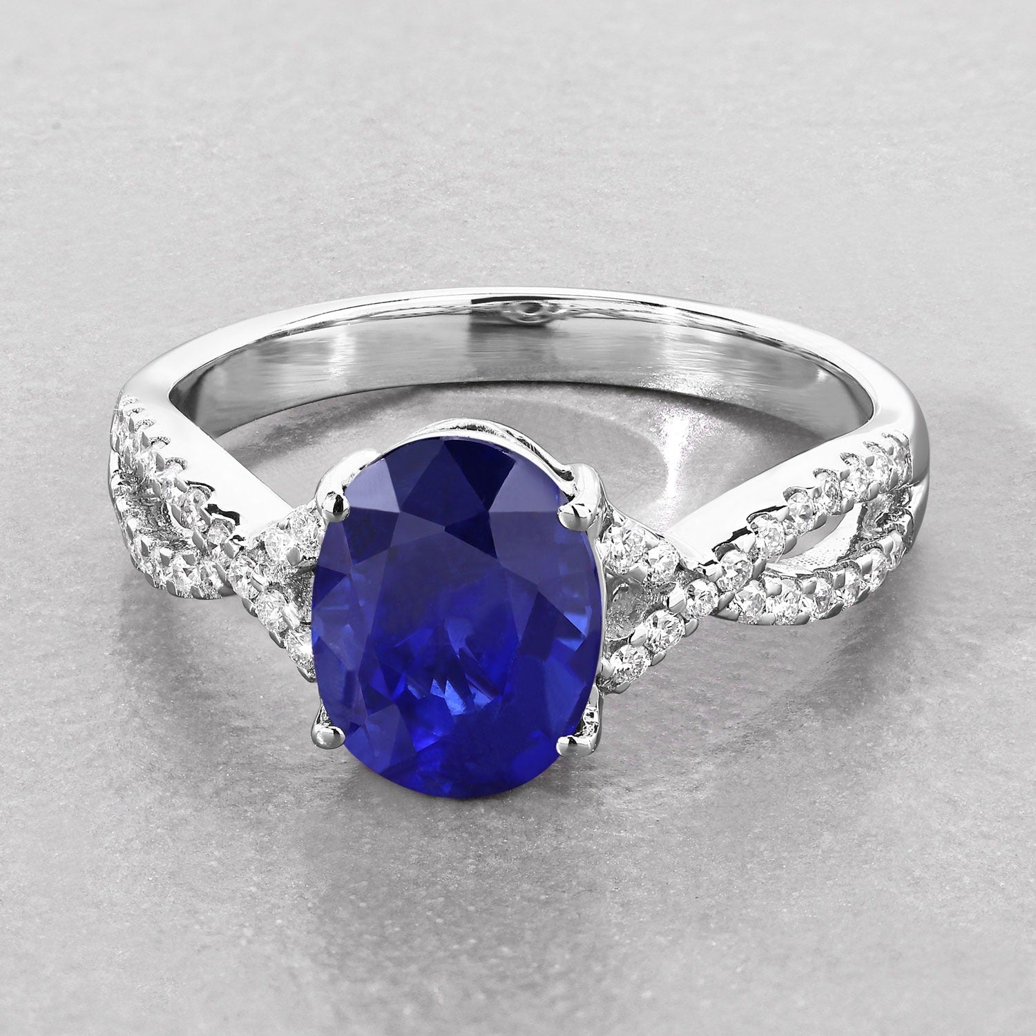 2.18 Ct Oval Ceylon Blue Sapphire and White Diamond Prong 18K White Gold Pave Crossover Engagement Ring