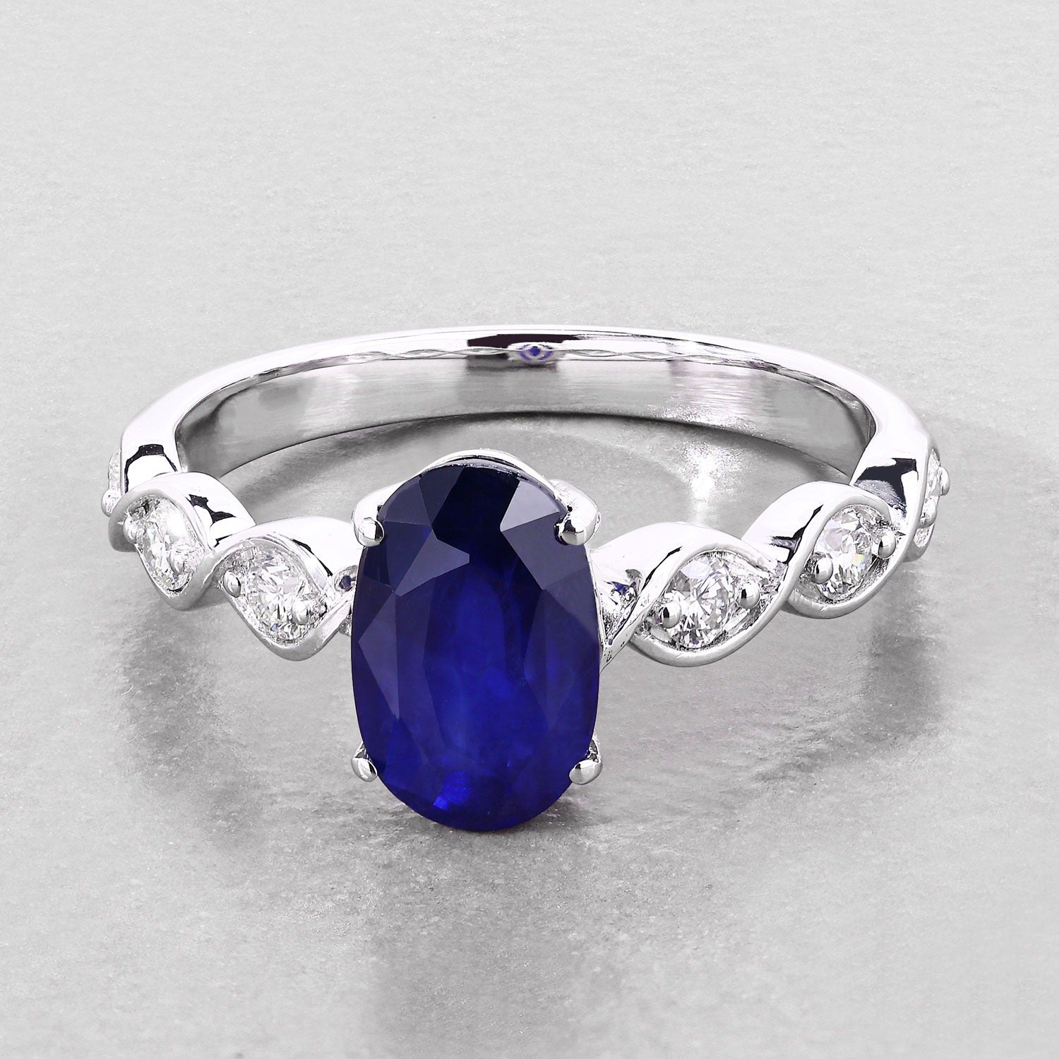 2.57 Ct Oval Ceylon Blue Sapphire and White Diamond Prong 18K White Gold Crossover Wedding Ring