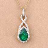 Genuine Zambian Emerald and White Diamond 14K Gold Crossover Pendant