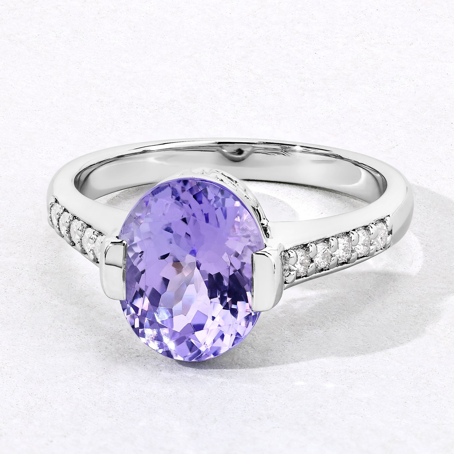 3.57 Cttw Oval Violet Tanzanite and Lab Diamond Rhodium over Silver Bridge Ring