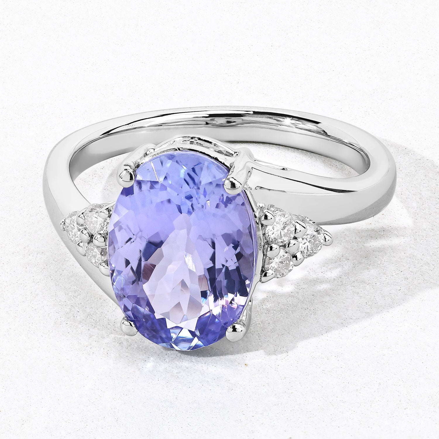 3.63 Cttw Oval Violet Tanzanite and Lab Grown Diamond Rhodium over Silver Bypass Ring