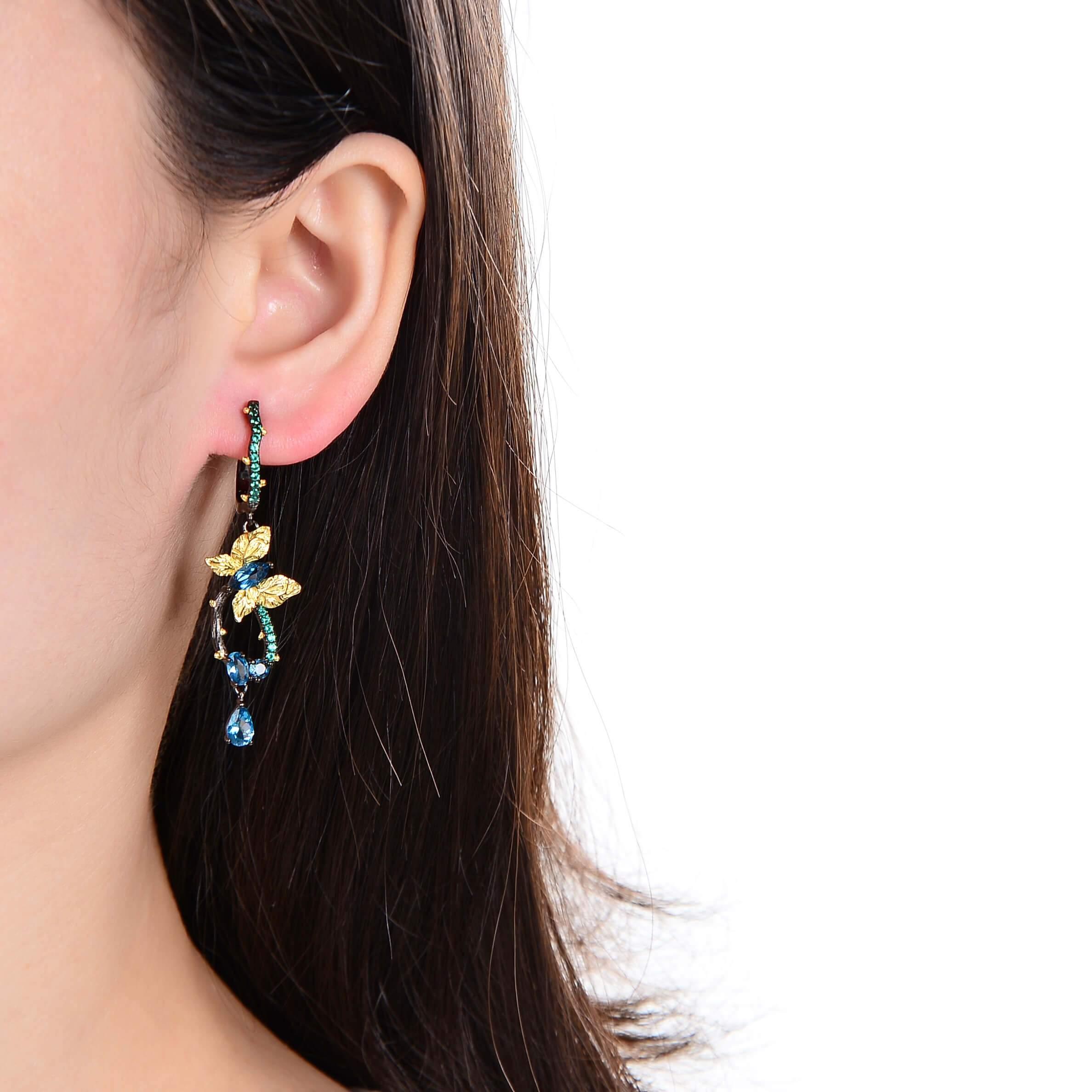 Artisan Blue Topaz Gold-Plated Butterly Earrings.
$ 50 - 100, Blue Topaz, Marquise, Oval, Pear, Blue, Green, 925 Sterling Silver, 925 Sterling Silver Ð Gold Plated Yellow, Dangle, Drop