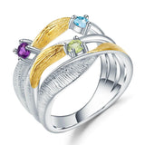 Signature Rhodium and Gold Plated Ring.
$ 50 - 100, Blue Topaz, Peridot, Amethyst, Round, 925 Sterling Silver, Dangle, Fashion