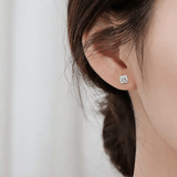 Model showcasing White Moissanite Stud Earrings - FineColorJewels
